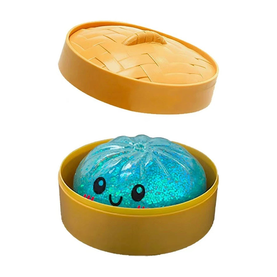 Light blue glitter dumpling squishy in steamer box