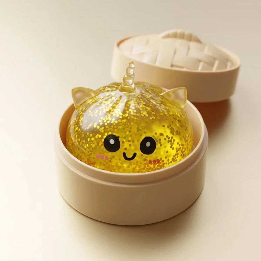 Gold unicorn dumpling squishy in bamboo steamer box